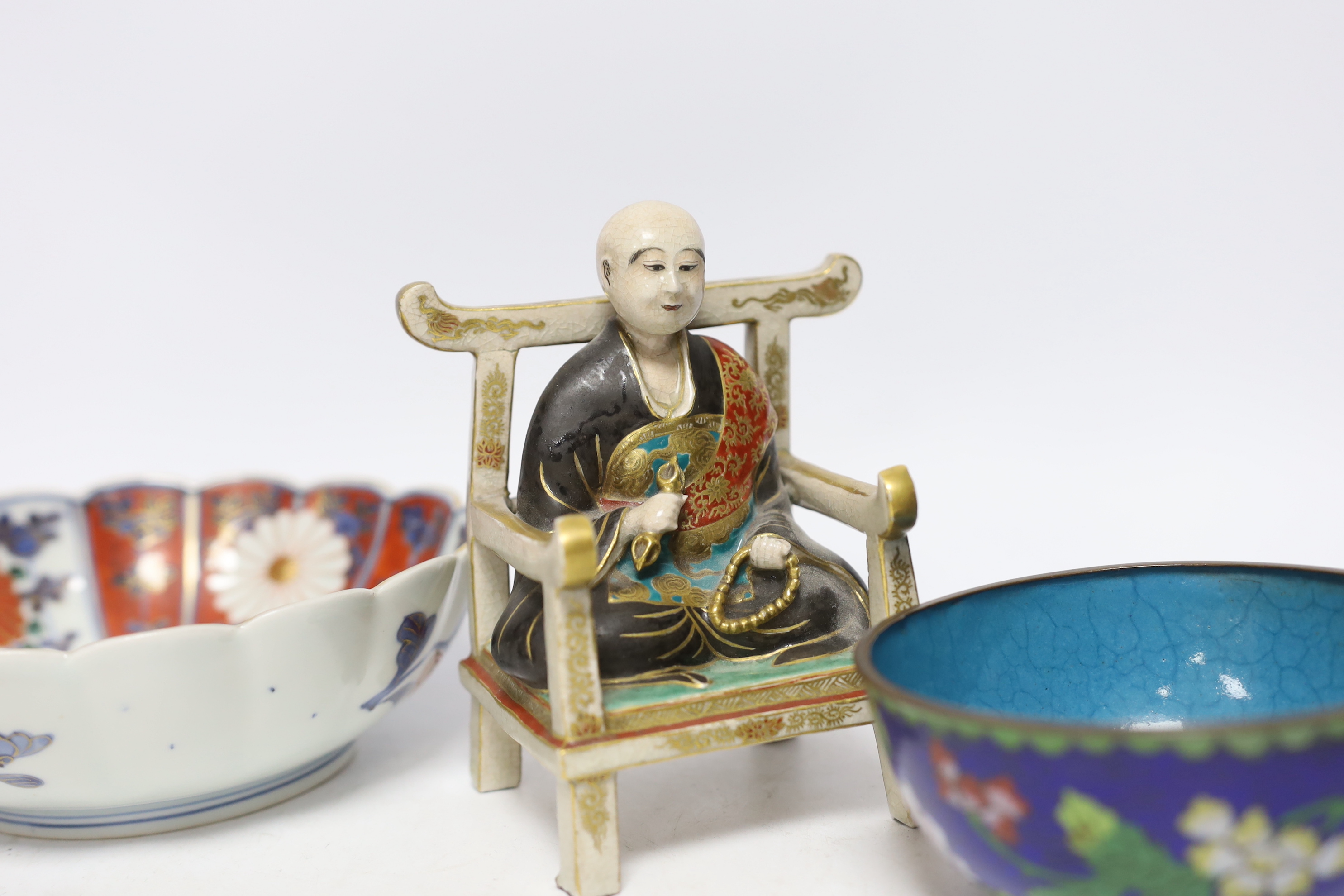 A Chinese enamelled yixing teapot and cloisonné bowl together with a Japanese Imari bowl and a Satsuma seated figure of a Buddhist monk, tallest 14cm